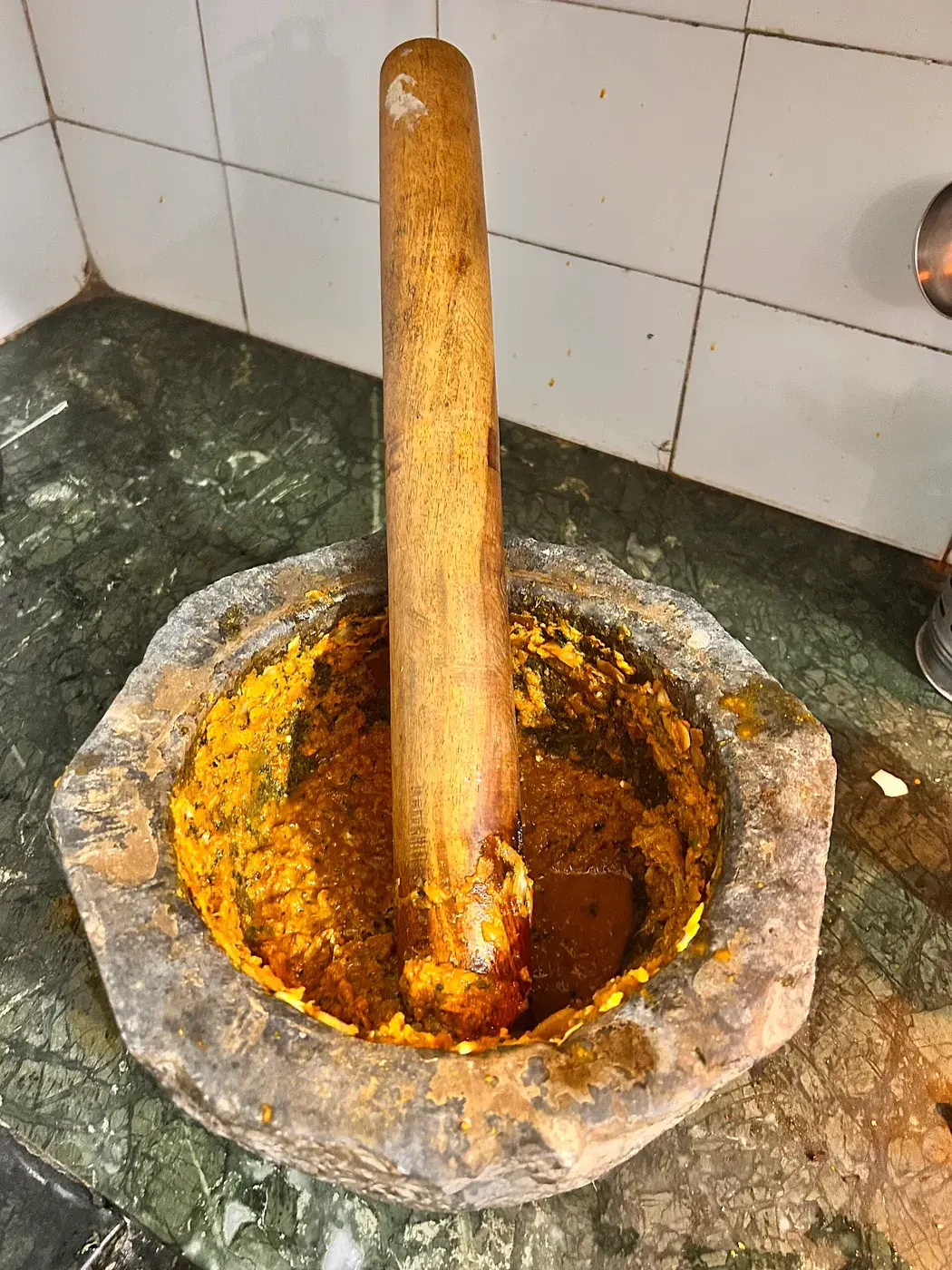Herbs being ground in a mortar