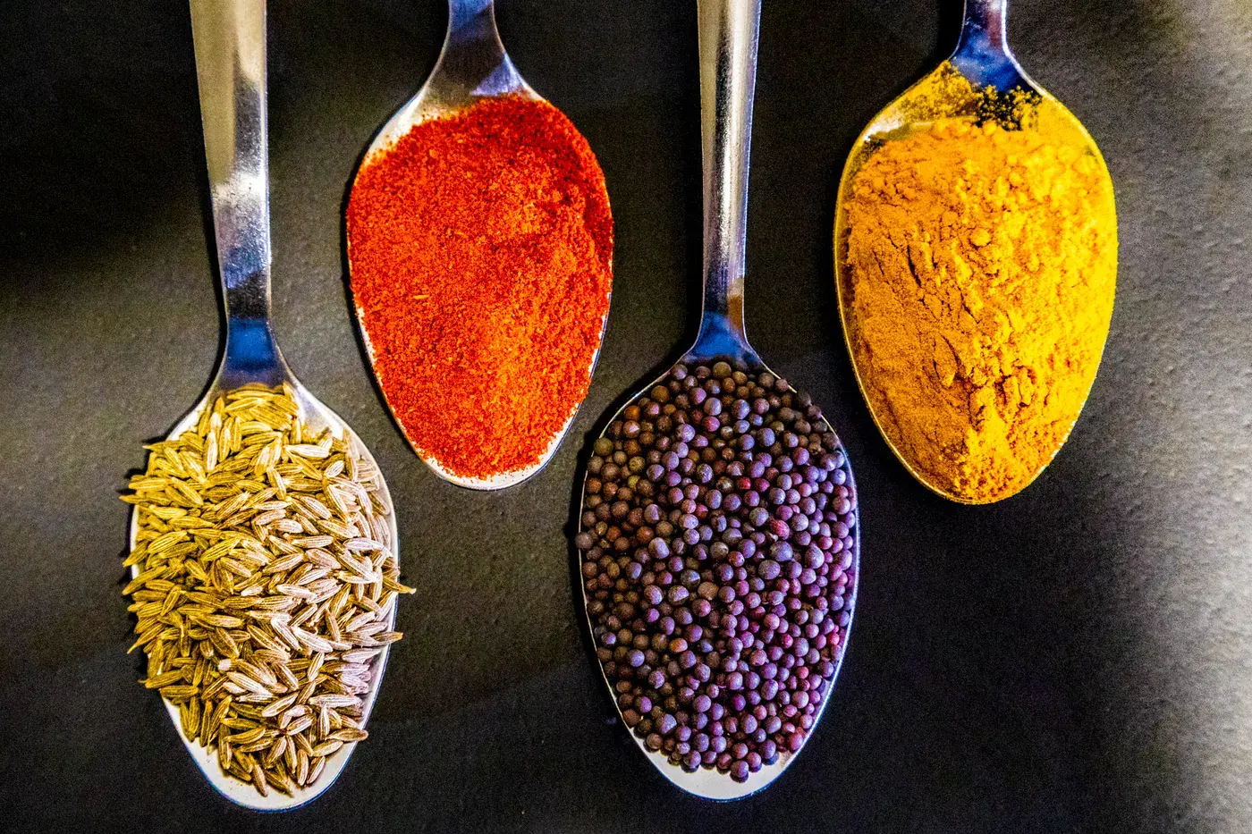 Spoonfuls of ground herbs and seeds